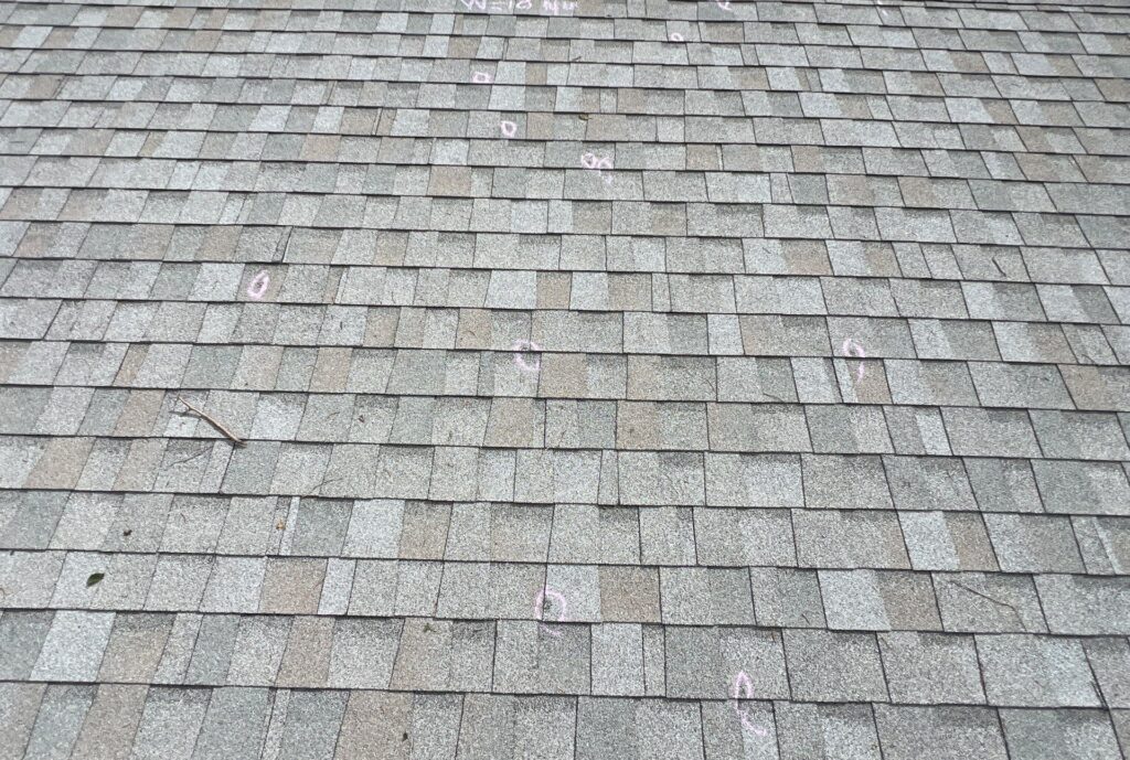 hail damage on asphalt shingle roof in Central Nebraska
